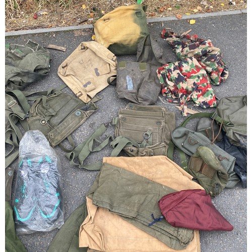 336 - Large bag of military surplus to include clothing, camouflage, rucksacks, bags etc