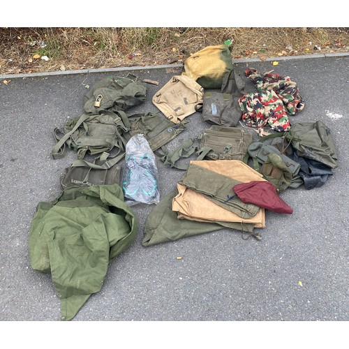 336 - Large bag of military surplus to include clothing, camouflage, rucksacks, bags etc