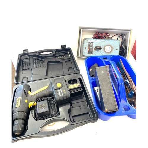 303 - Selection of tools to include drill and accessories, battery charger, drill bits