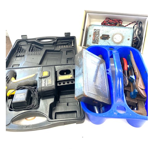 303 - Selection of tools to include drill and accessories, battery charger, drill bits