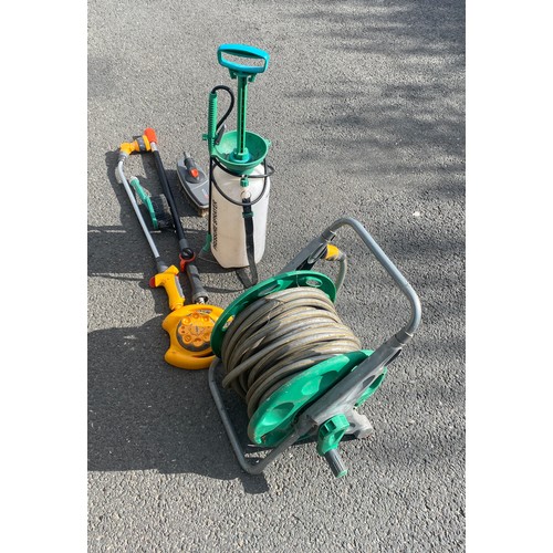 292 - Selection of garden tools to include hose pipe on reel, sprayers etc