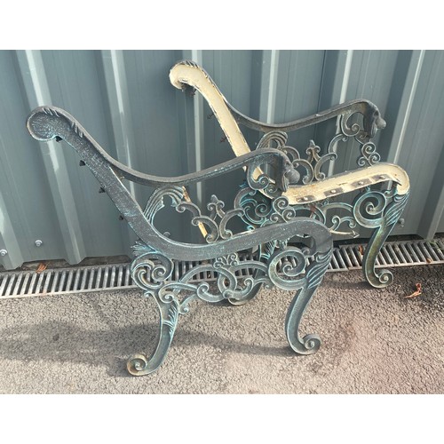 100A - A pair of cast iron bench ends