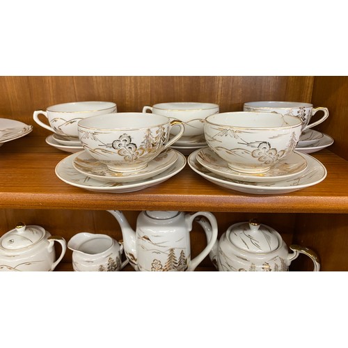 310 - Oriental Lithophane Ware to include 6 coffee cups, milk jug, sugar pot, five tea cups 1 repaired, su... 