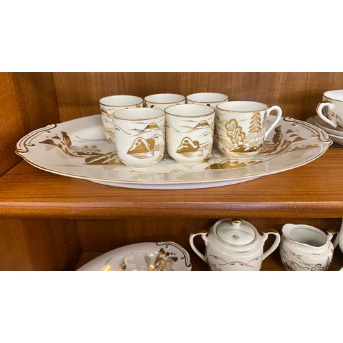 310 - Oriental Lithophane Ware to include 6 coffee cups, milk jug, sugar pot, five tea cups 1 repaired, su... 