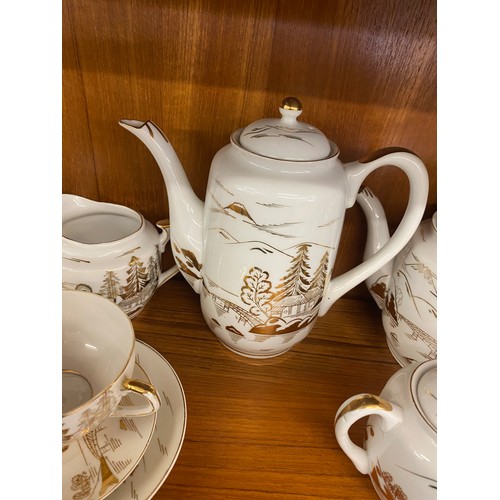 310 - Oriental Lithophane Ware to include 6 coffee cups, milk jug, sugar pot, five tea cups 1 repaired, su... 