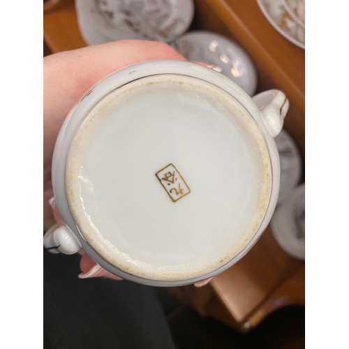 310 - Oriental Lithophane Ware to include 6 coffee cups, milk jug, sugar pot, five tea cups 1 repaired, su... 