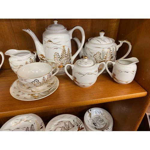 310 - Oriental Lithophane Ware to include 6 coffee cups, milk jug, sugar pot, five tea cups 1 repaired, su... 