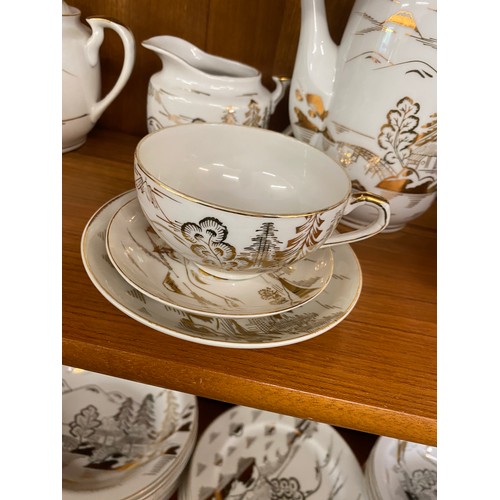 310 - Oriental Lithophane Ware to include 6 coffee cups, milk jug, sugar pot, five tea cups 1 repaired, su... 