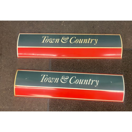 321 - Two town and country plastic signs measures approx 39 inches length