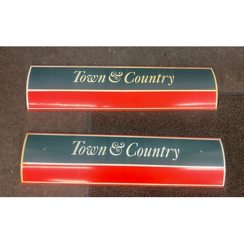 321 - Two town and country plastic signs measures approx 39 inches length