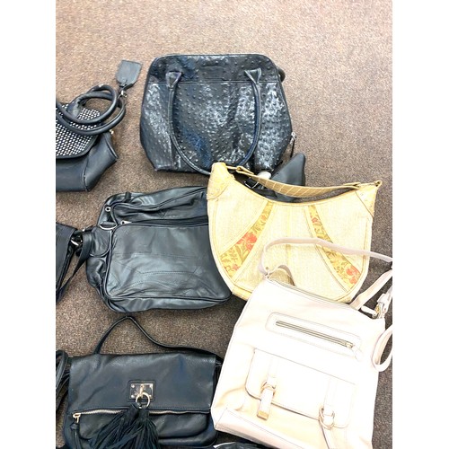 284 - Large selection of ladies handbags