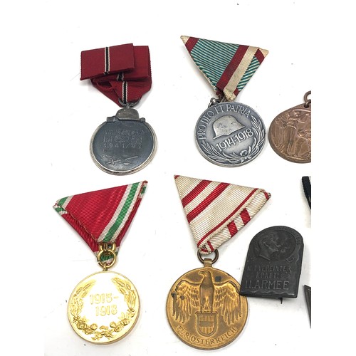 463 - collection of ww1 &ww2 medals & badges includes german ww2 eastern front ww1 hungary medal etc