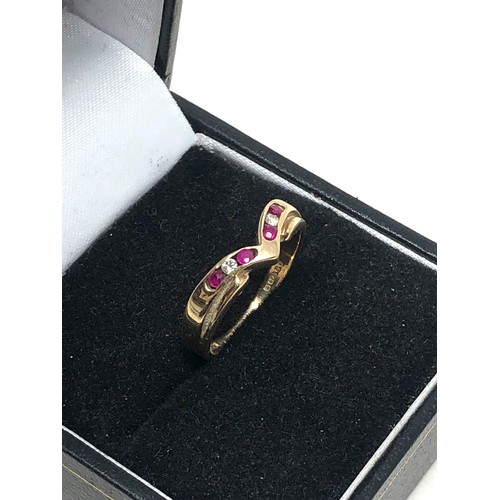 356 - 9ct gold ruby & diamond wishbone ring (2g)