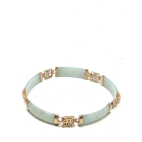 235 - 9ct gold jade oriental panel bracelet (10.5g)