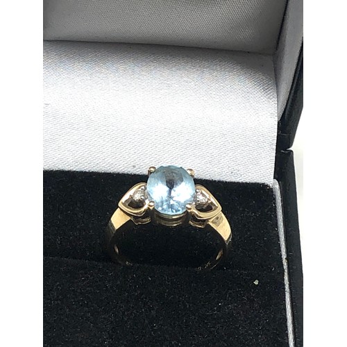 279 - 9ct gold blue topaz & diamond three stone dress ring (2.7g)