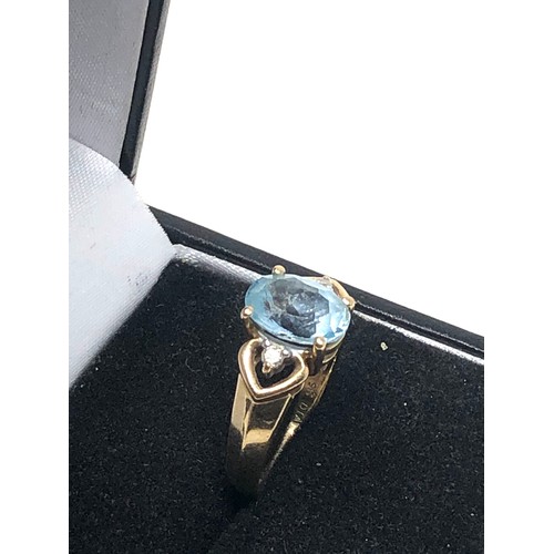 279 - 9ct gold blue topaz & diamond three stone dress ring (2.7g)