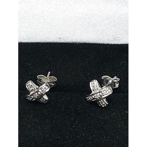 230 - 14ct white gold white sapphire knot stud earrings (1g)