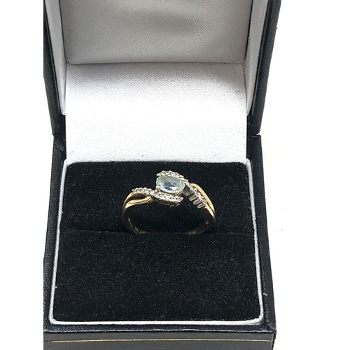 248 - 9ct gold blue topaz & diamond ring (1.9g)