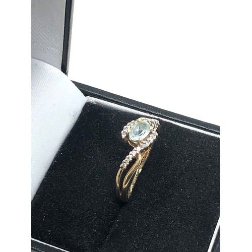 248 - 9ct gold blue topaz & diamond ring (1.9g)