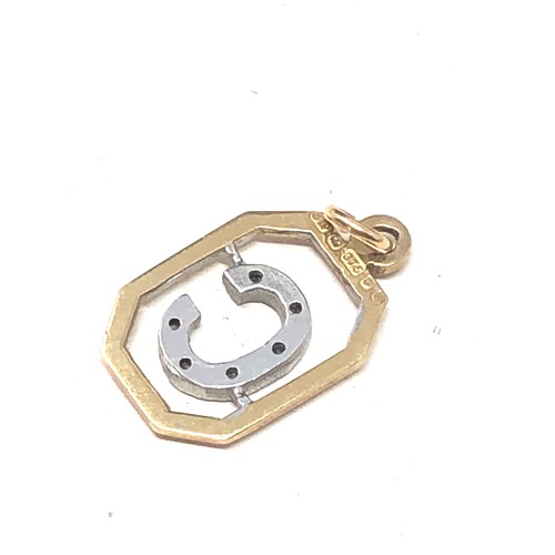 246 - 9ct gold diamond framed 'c' pendant (1g)