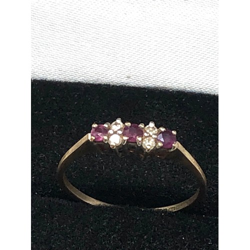 252 - 9ct gold ruby & diamond ring (1g)