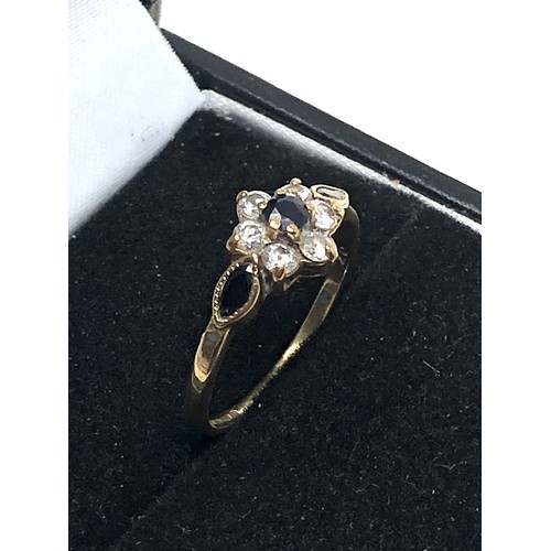 320 - 9ct gold sapphire & clear gemstone floral ring (1.4g)