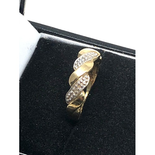 330 - 9ct gold diamond twist ring (1.7g)