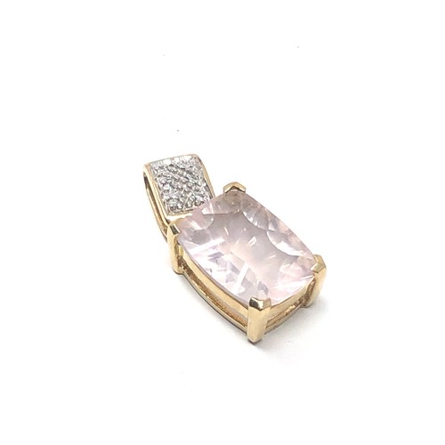 131 - 9ct gold framed diamond & milky quartz pendant (3.4g)