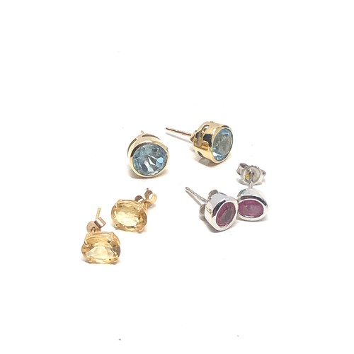 175 - 3 x 9ct gold paired gemstone stud earrings inc. topaz, ruby & citrine (4.5g)