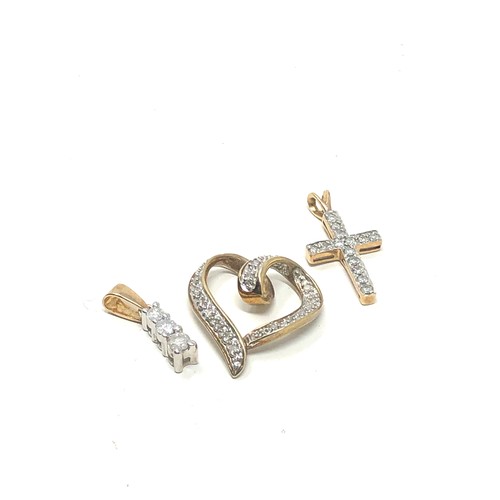 228 - 3 x 9ct gold diamond set pendants inc. heart, cross & bar (3.5g)