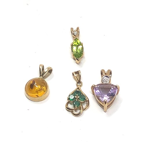 362 - 4 x 9ct gold gemstone pendants inc. amethyst, amber, peridot, diamond & emerald (4.1g)