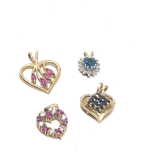 212 - 4 x 9ct gold gemstone set heart pendants inc. ruby, sapphire, topaz, diamond & clear gemstone (4.8g)