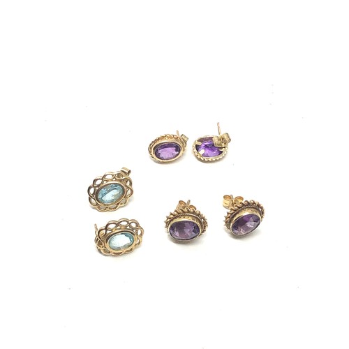 215 - 3 x 9ct gold paired gemstone stud earrings inc. amethyst & topaz (4.2g)