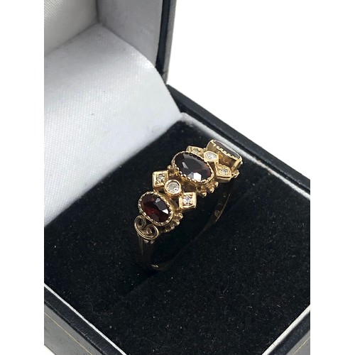 163 - 9ct gold garnet & diamond ring (2.8g)