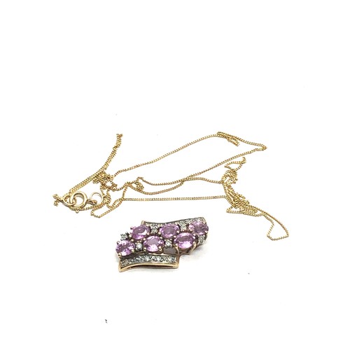 148 - 9ct gold diamond & pink sapphire pendant & chain  2.4g