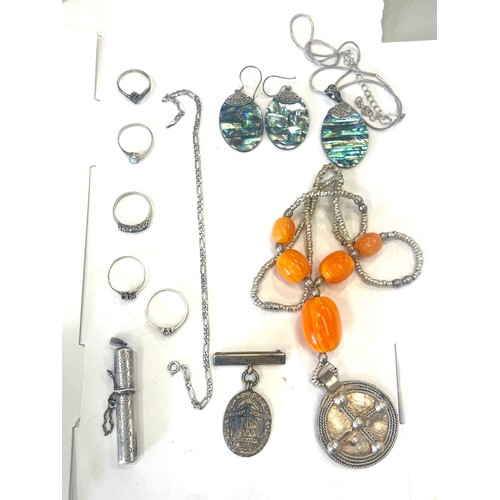 565 - Selection of silver jewellery includes 5 silver rings, Abalone set jewellery, silver Junior Gas meda... 