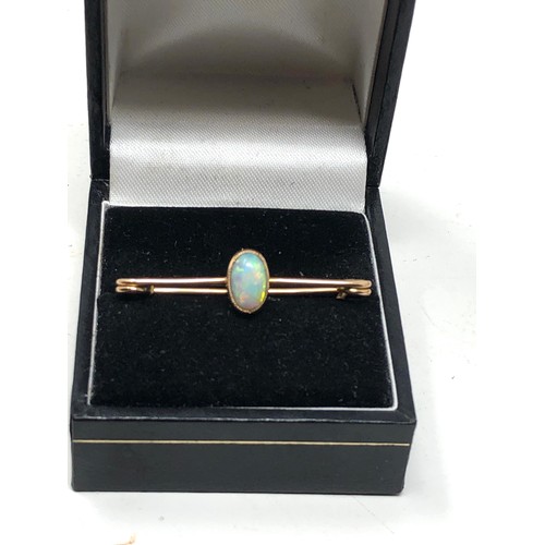 57 - Antique 15ct gold opal brooch set with  central opal that measures approx 13mm by 5.5mm frame xrt te... 