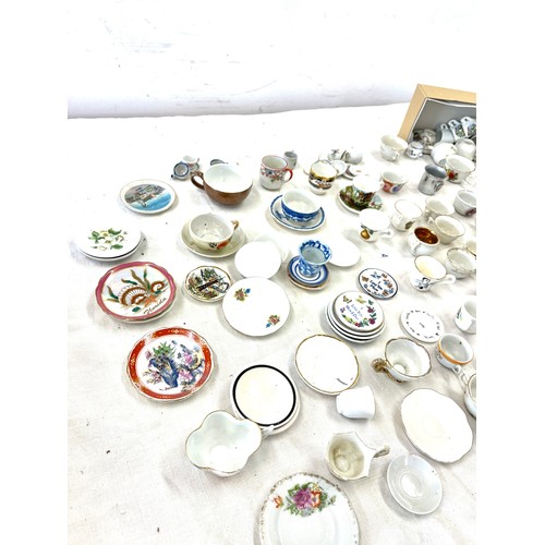 43 - Large selection of assorted miniature cups a saucers