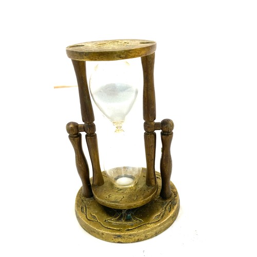 596 - Vintage brass egg timer measures approx 4 inches tall