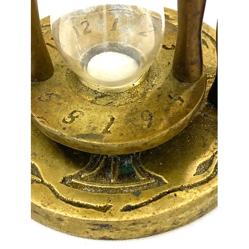 596 - Vintage brass egg timer measures approx 4 inches tall