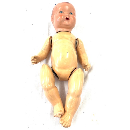 86 - Vintage jointed doll, approximate length 16.5 inches