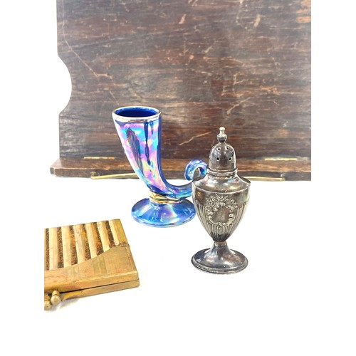 71 - Assortment of items to include a novelty cigarette holder, pencil sharper, wooden music table top st... 