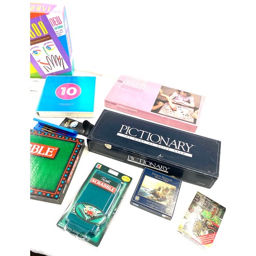 259 - Large selection of assorted games includes Pictonary, just 10, scrabble etc