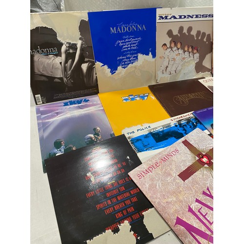 100 - Selection of pop/inst LP records to include Madonna, Police, Madness etc

Damage to some record slee... 