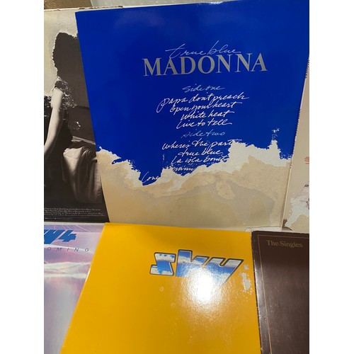 100 - Selection of pop/inst LP records to include Madonna, Police, Madness etc

Damage to some record slee... 