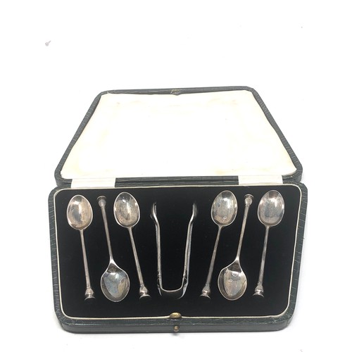 33 - Boxed set of silver tea spoons & sugar tongs