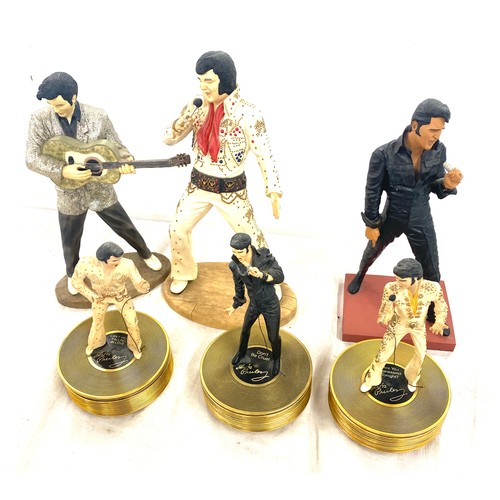 320 - A selection of Elvis Presley figures and three figures from the Elvis: Forever gold sculptural music... 