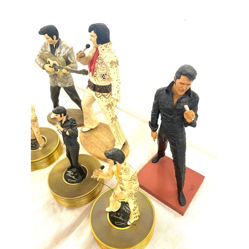 320 - A selection of Elvis Presley figures and three figures from the Elvis: Forever gold sculptural music... 