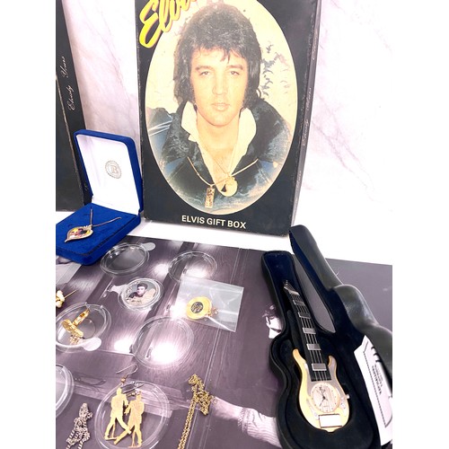 414 - Selection of Elvis Presley memorabilia to include jewellery, coins, watch etc