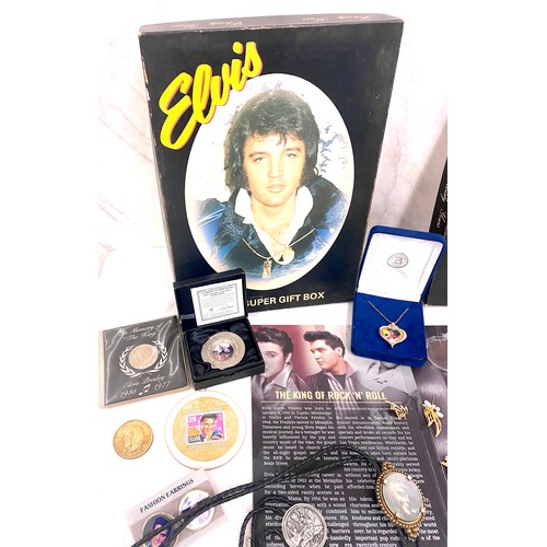 414 - Selection of Elvis Presley memorabilia to include jewellery, coins, watch etc